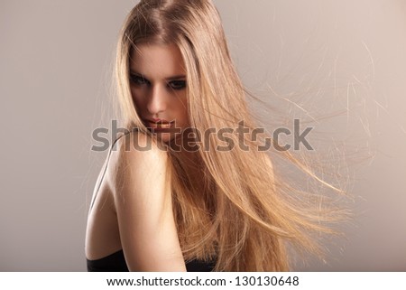 young model with electrified long straight hair