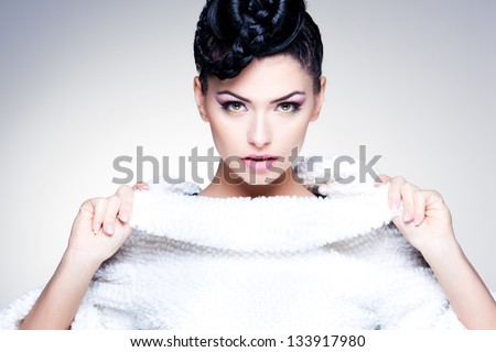beauty shot of beautiful woman wearing professional make-up and hairstyle