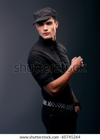 portrait of a attractive young male model serious attitude - studio shoot