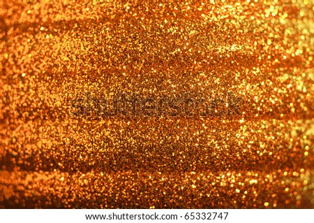 red golden glitter background - macro of a Christmas ball
