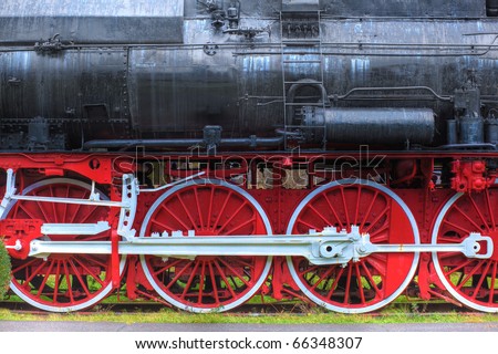 old steam locomotive with big red and white wheels - side view