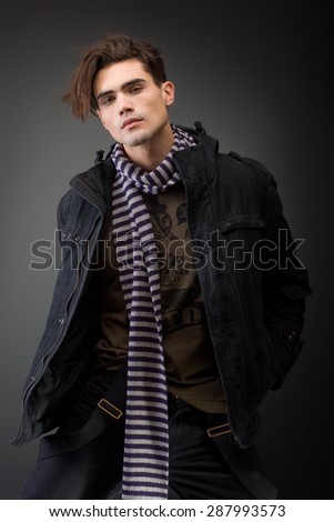 portrait of a handsome young male model with serious attitude- studio shoot