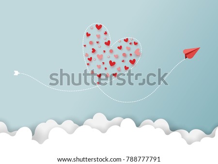 Paper art style of valentine's day greeting card and love concept.Red airplanes flying look like heart shape on clouds and blue sky.Vector illustration.