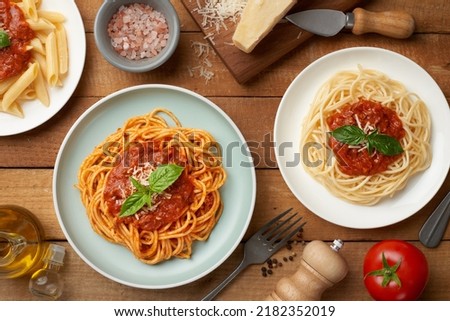 Similar – Image, Stock Photo Spaghetti and the sauce ingredients, top view. Uncooked pasta isolated brown colored table.