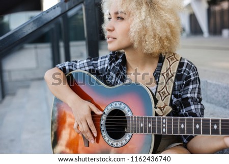 Similar – Image, Stock Photo Calm woman playing guitar in bedroom