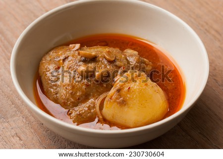 Close up Muslim style chicken and potato curry or chicken mussaman curry - deep focus image with path