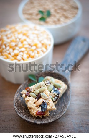 Healthy Snack : Cereal Bars : germinate rice whole grains with fruits on wooden board, Multigrain Bar