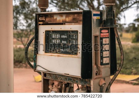 Similar – Image, Stock Photo Old dilapidated fuel pump for liquid fuel in detail with reflection of a blue oh so environmentally friendly xyz car