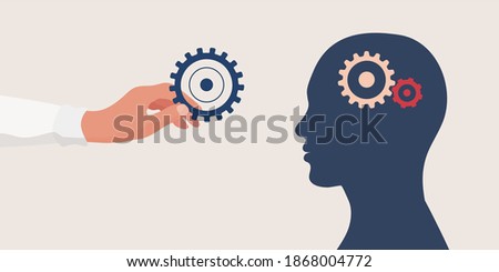 Mental health concept.Therapist or doctor hand holding a gear for as a symbol of mental care.Head with cogs.Psychology and psychiatry. Depression.Stress.Mind.Disease.Psychotherapy.Mood