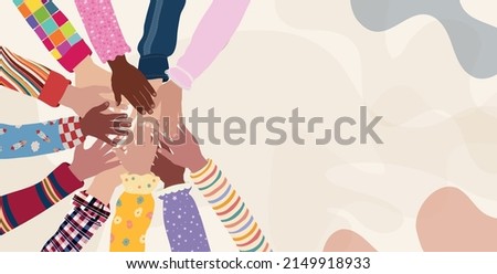 Concept of inclusion diversity equality. Group of multicultural children s arms and hands in a circle on top of each other. Children and babies from different country nations and continents