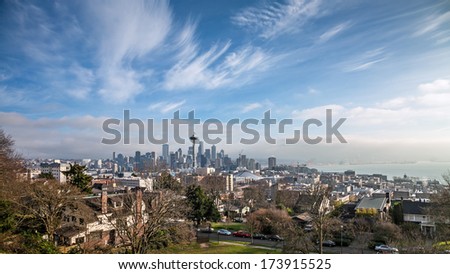 Seattle, USA, JANUARY 2014: View over the Seattle skyline from Kerry Park. A sunny day, blue sky some clouds on the sky. The prominent Space Needle to be seen in the front. January 17, 2014