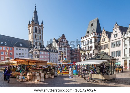 Trier, GERMANY - MARCH 03: Marketplace in Trier with its colorful stalls with merchants selling flowers and souvenirs. March 03, 2014 in Trier, Germany