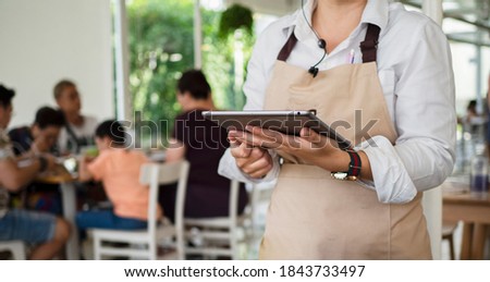 Similar – Image, Stock Photo Crop Asian waitress serving burger in cafe