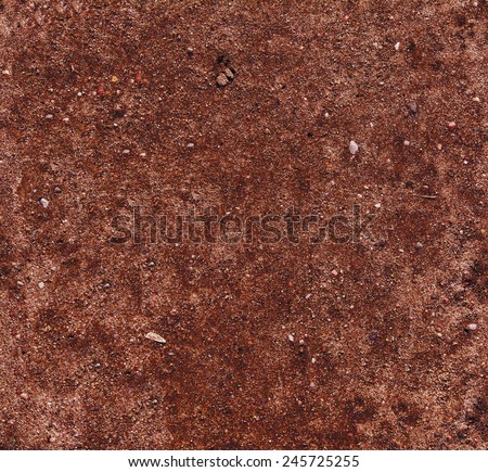 Tropical laterite soil or red earth background. Red mars seamless sand background. Top view