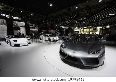 PARIS - OCTOBER 13 : People look at the Lamborghini stand at the 2008 Paris Motor Show October 13, 2008 in Paris. The show attracts more of one million people every 2 years