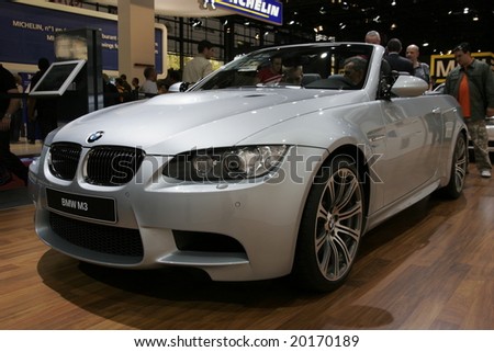 PARIS - OCTOBER 13 : People look at the Bmw m3 roadster at the 2008 Paris Motor Show October 13, 2008 in Paris. The show attracts more of one million people every 2 years