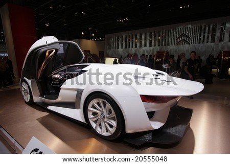 PARIS - OCTOBER 13 : People look at the Citroen Grandturismo at the 2008 Paris Motor Show October 13, 2008 in Paris. The show attracts more of one million people every 2 years