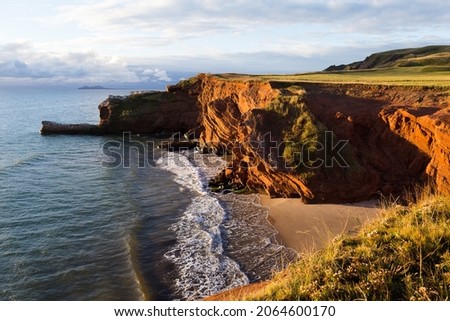 High angle view of red sandstone cliffs and Dunes-du-Sud beach seen during a sunny fall sunrise, Havre-aux-Maisons, Magdalen Islands, Quebec, Canada Stock fotó © 