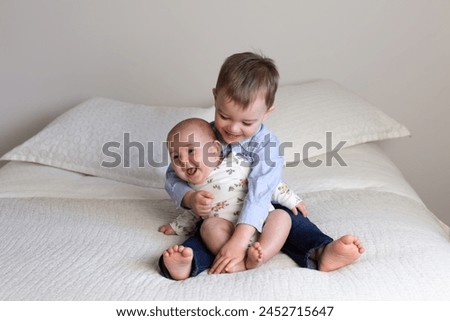 Similar – Image, Stock Photo Brother and sister with wool hat