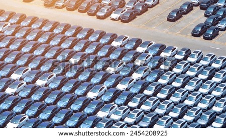 Similar – Image, Stock Photo Parking space management ::: five bicycles and a power bolt basking in the sun on a boring red brick wall