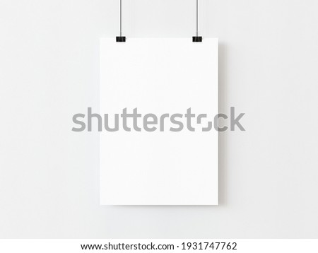 One blank vertical rectangle poster template hanging on thread with paper clips on white background. 3D illustration