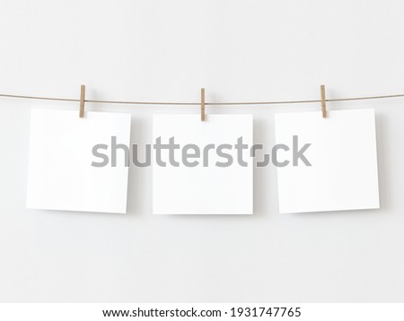 Set of three note paper cards hanging with wooden clip or clothespin on rope string peg isolated on white backgroun. 3D illustration