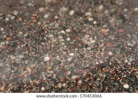 Pebbles in a lake.  Lake Superior, Grand Marais, MI, USA.