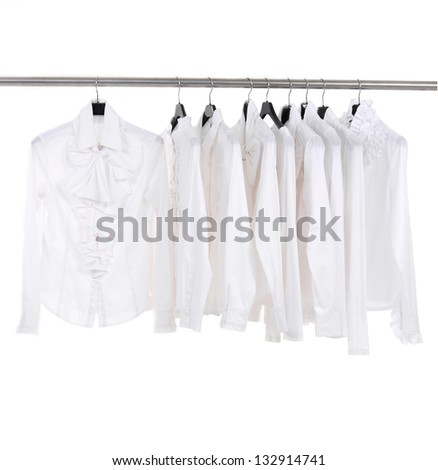 White female white jacket on hangers at the show - stock photo