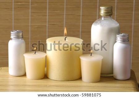 Cosmetics for body, cosmetic bottle and towel on straw napkin