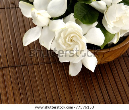 Bowl of gardenia flower on the bamboo tray