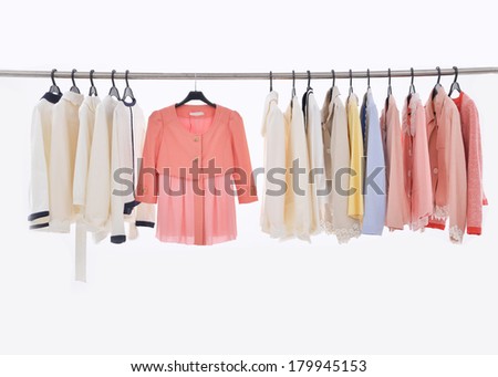 Female Variety of colorful clothes hanging on the rack Stock fotó © 