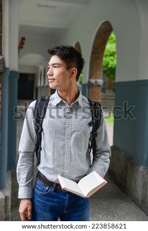 Asian college student in jeans at college