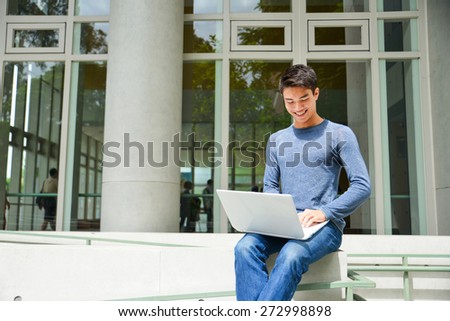Asian college student sitting at college