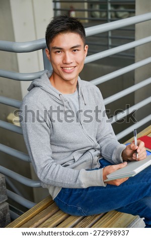 Portrait of college student in jeans at college