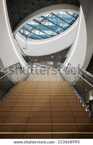 VIENNA, AUSTRIA - JULY 6: Stairs and oval window in shopping center The Mall shown on 6 July 2013 in Vienna. The Mall opened 2013 and is part of the Wien Mitte Center.