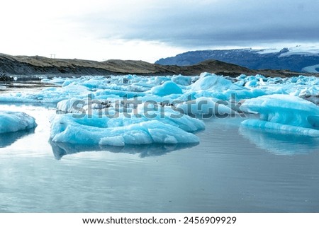 Similar – Image, Stock Photo Glacier Lagoon with icebergs from above. Aerial View. Cracked Ice from drone view. Background texture concept.