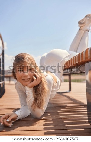 Similar – Image, Stock Photo Young woman doing stretching exercises on nature in mountains. Sports girl practicing yoga pose in leggings. beautiful forest landscape