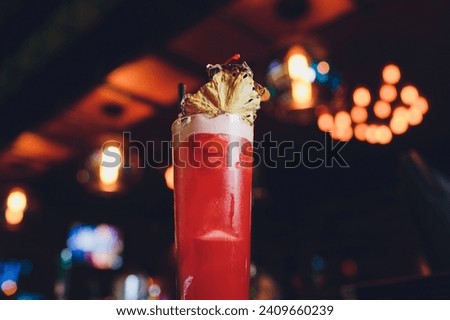 Similar – Image, Stock Photo Fresh colorful exotic alcoholic cocktail with orange and rosemary on the bar desk. Tasty Soft drink with fruits. selective focus