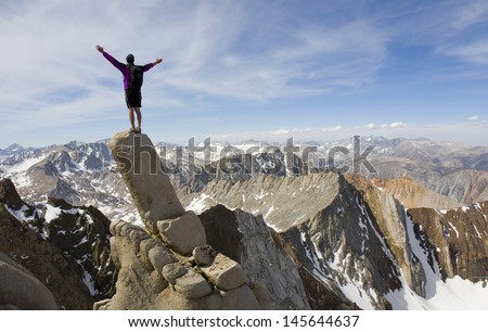Man on top of the mountain