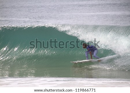 PENICHE, PORTUGAL - OCT 13: Matt Wilkinson tube riding a wave in round 1, heat 9 at WCT contest, Rip Curl Pro in Peniche, Portugal on October 13, 2012