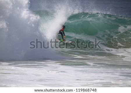PENICHE, PORTUGAL - OCT 13: Gabriel Medina tube riding a wave in round 1, heat 9 at WCT contest, Rip Curl Pro in Peniche, Portugal on October 13, 2012