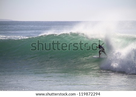 PENICHE, PORTUGAL - OCT 13: Mick Fanning tube riding a wave in round 2, heat 1 at WCT contest, Rip Curl Pro in Peniche, Portugal on October 13, 2012