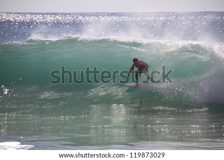 PENICHE, PORTUGAL - OCT 13: Julian Wilson tube riding a wave in round 1, heat 12 at WCT contest, Rip Curl Pro in Peniche, Portugal on October 13, 2012