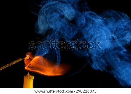 Smoke from a burning candle and matches