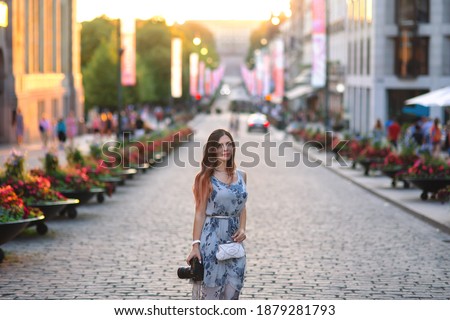 https://image.shutterstock.com/display_pic_with_logo/174511180/1879281793/stock-photo-young-beautiful-woman-walking-on-karl-johans-street-in-oslo-norway-1879281793.jpg