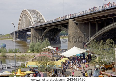 NIJMEGEN, THE NETHERLANDS 16 JULY 2013  People from all over the world walk over de bridge in Nijmegen around 50 kilometers per day, four days long. It is a yearly event in July.