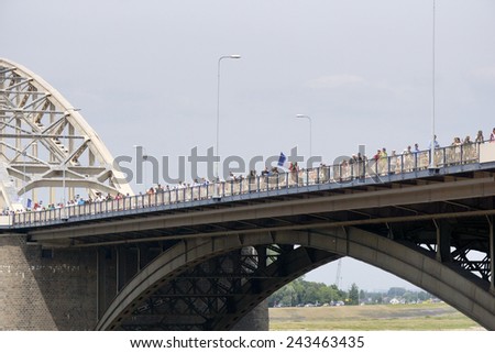 NIJMEGEN, THE NETHERLANDS  16 JULY 2013  People from all over the world walk over de bridge in Nijmegen around 50 kilometers per day, four days long. It is a yearly event in July.