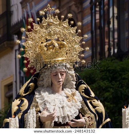 SEVILLE, SPAIN - 16 MARCH 2014: Procession with Maria Auxiliadora in the district La Triana, Seville, Spain. Photo taken on March 16th 2014 in Seville, Spain.