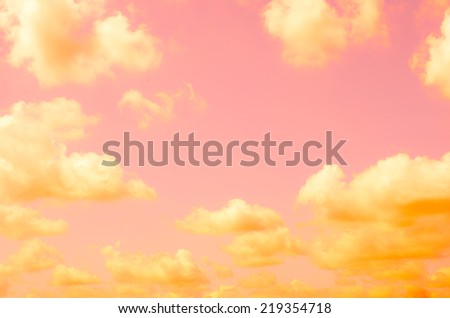 orange fluffy clouds in the pink sky