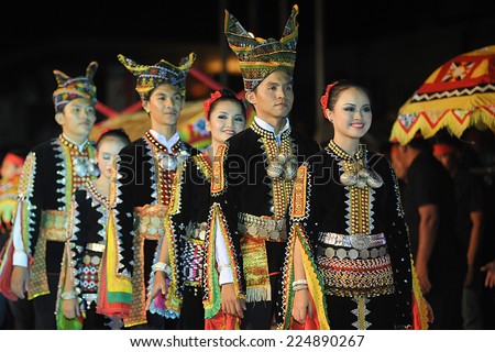 Kota Belud, Sabah Malaysia. October 18, 2014 : A group of Dusun Tindal ethnic in colorful traditional costume participating in parade during folklore festival in Kota Belud Sabah.